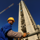 A Chinese worker is seen below the 270-meter-high minaret at the construction site of the Great Mosque of Algiers.